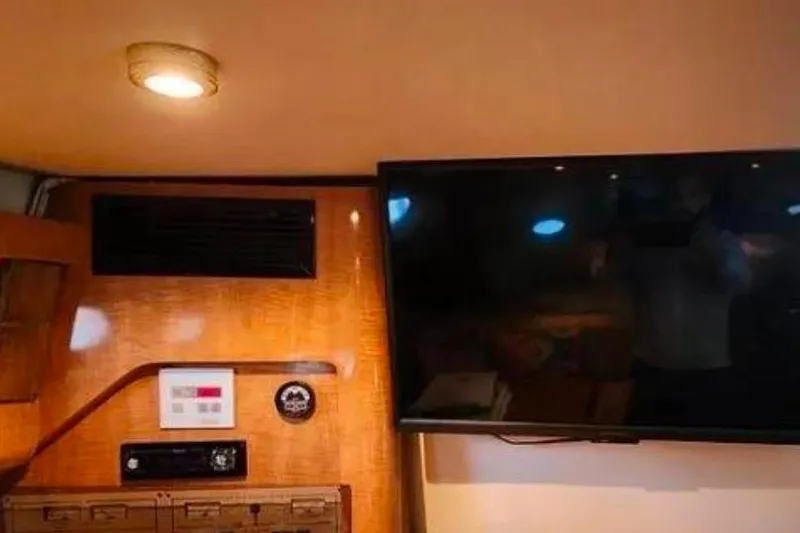 Slide: The Image of Interior of 2001 Regal Commodore 2960 with mounted TV and control panel. - 10