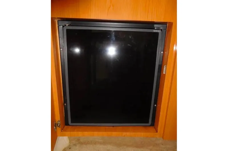 Slide: The Image of Built-in refrigerator on 2001 Regal Commodore 2960 boat, wooden cabinet. - 17