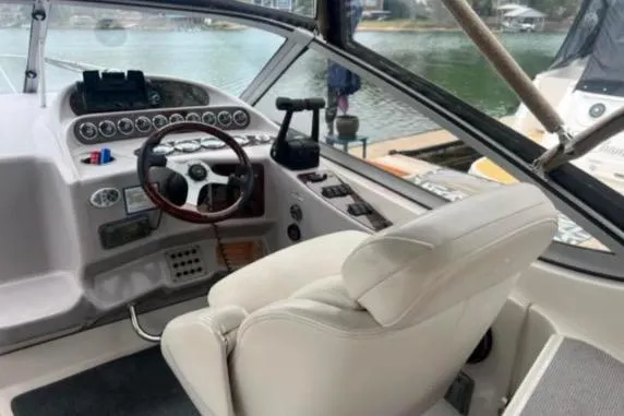 Slide: The Image of 2001 Regal Commodore 2960 boat cockpit with steering wheel and control panel. - 4