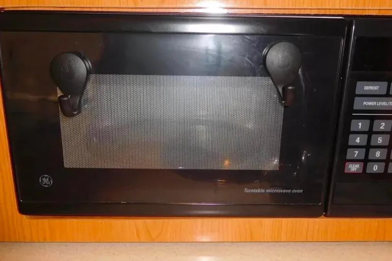 Slide: The Image of GE turntable microwave oven in a 2001 Regal Commodore 2960 boat kitchen. - 5