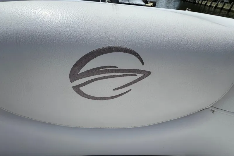 Slide: The Image of Crownline 305 SS 2012 boat seat with embroidered logo, white leather upholstery. - 18