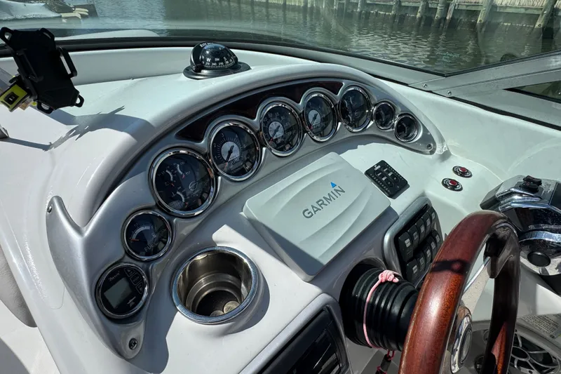 Slide: The Image of Dashboard of a 2012 Crownline 305 SS boat with Garmin navigation system. - 21