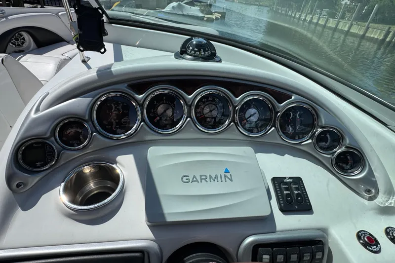 Slide: The Image of Dashboard of a 2012 Crownline 305 SS boat with Garmin navigation system. - 22