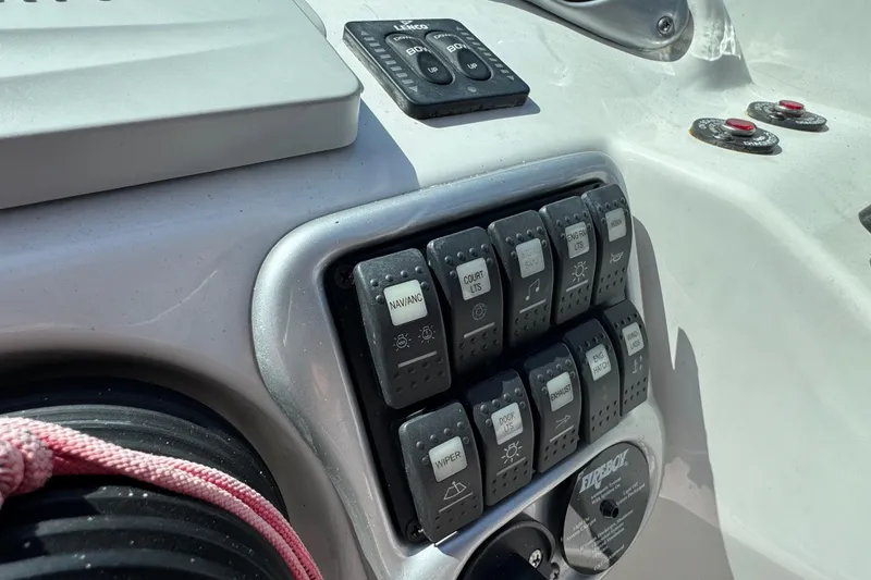 Slide: The Image of Control panel of a 2012 Crownline 305 SS boat with labeled switches and buttons. - 24