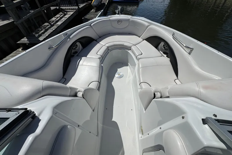 Slide: The Image of 2012 Crownline 305 SS boat interior with spacious seating and sleek design. - 29