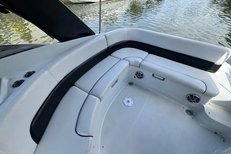Slide: The Image of 2012 Crownline 305 SS boat interior with white seating and water view. - 5