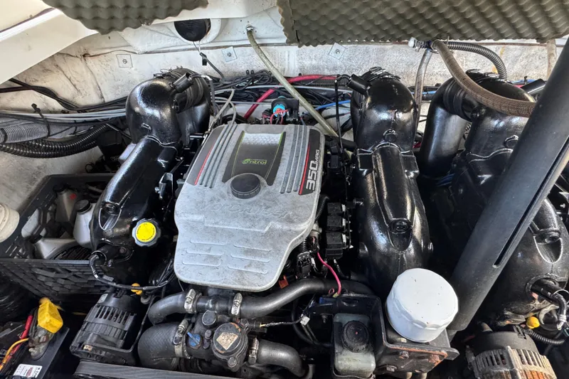 Slide: The Image of Engine of a 2012 Crownline 305 SS boat, featuring a 350 MAG motor. - 9