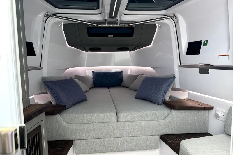 Slide: The Image of 2024 Axopar 37 XC CROSS CABIN interior with cozy bed and modern design. - 21