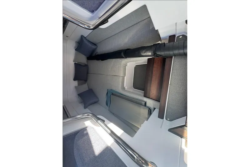 Slide: The Image of 2024 Axopar 37 XC CROSS CABIN interior with cushions and sleek design. - 24