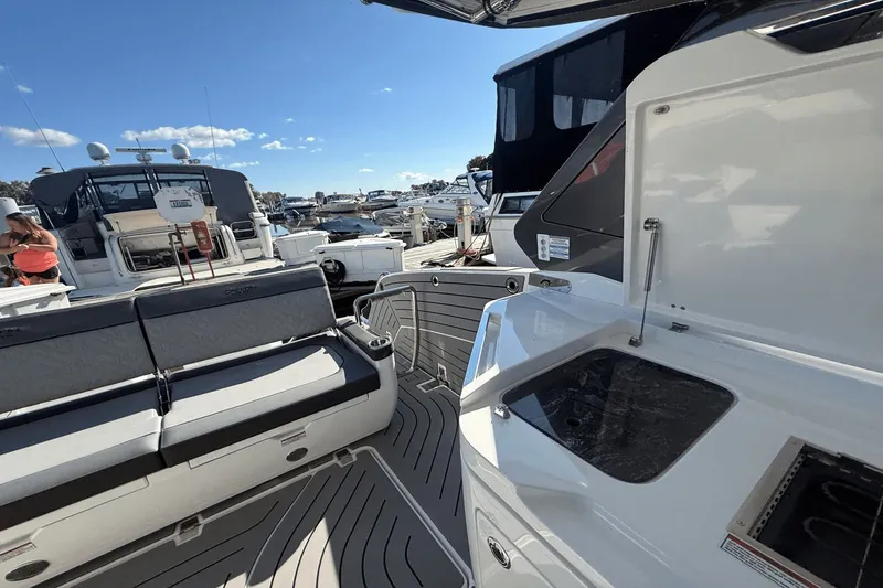 Slide: The Image of Galeon 325 GTO 2024 storage compartments with blue LED lighting. - 18