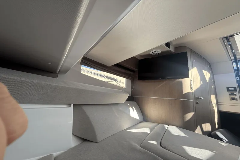 Slide: The Image of Interior of 2024 Galeon 325 GTO with cozy seating area. - 32