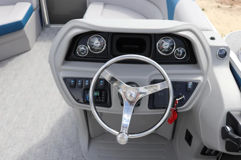 Slide: The Image of Steering console of 2025 Trifecta 22 RF LE 2.75 pontoon boat with gauges and controls. - 6