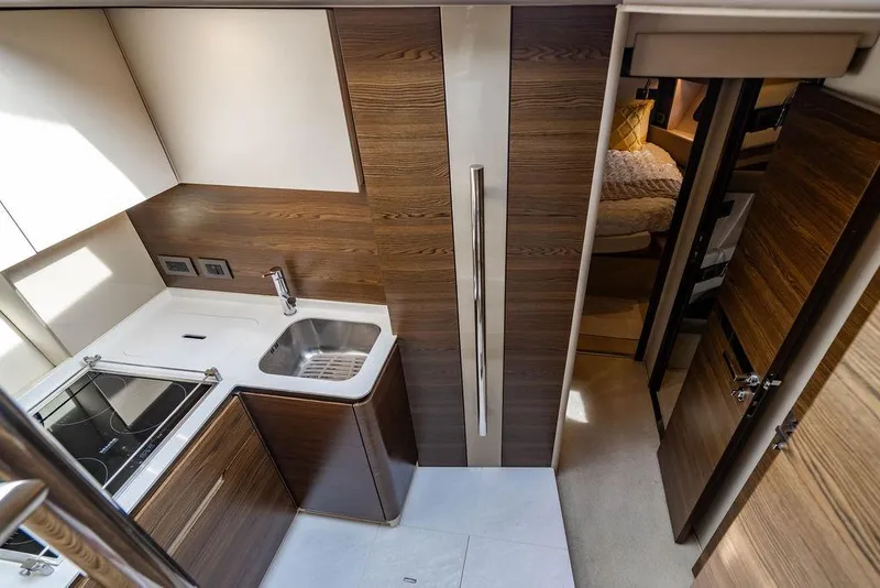 Slide: The Image of Luxurious kitchen interior of 2015 Azimut Fly 50 yacht with modern wood finishes. - 101