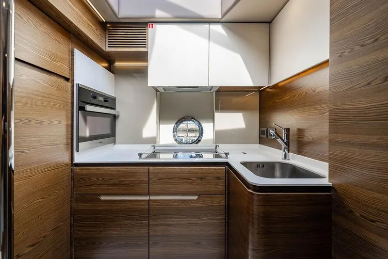 Slide: The Image of Luxurious kitchen interior of 2015 Azimut Fly 50 yacht with modern appliances and wood finish. - 102