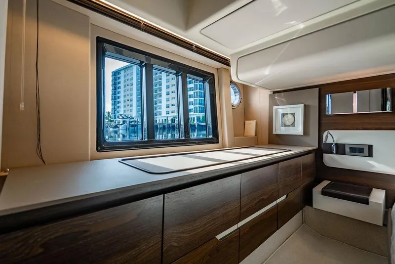 Slide: The Image of Luxurious interior of 2015 Azimut Fly 50 yacht with modern cabinetry and window view. - 108