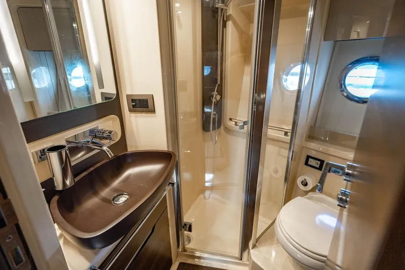 Slide: The Image of Luxurious bathroom in 2015 Azimut Fly 50 yacht with modern fixtures and porthole window. - 119