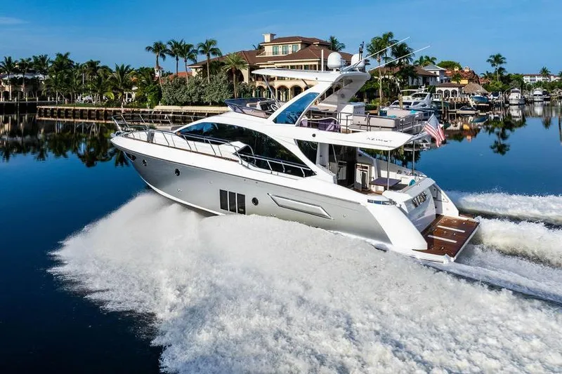 Slide: The Image of Luxury Azimut Fly 50 yacht cruising on a serene waterway, 2015 model. - 18