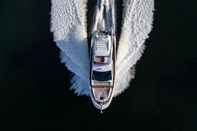 Slide: The Image of Azimut Fly 50 yacht cruising on water, aerial view, 2015 model. - 25