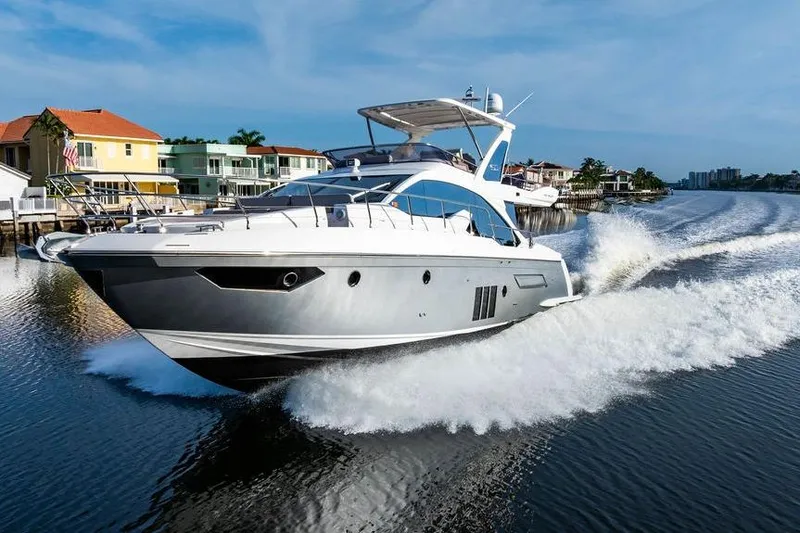 Slide: The Image of 2015 Azimut Fly 50 yacht cruising on a scenic waterway. - 26
