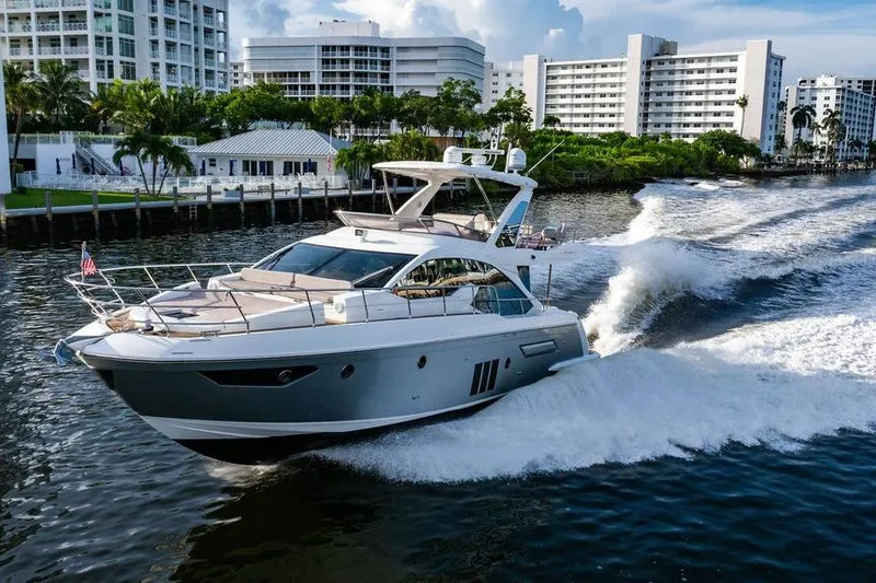 Slide: The Image of Luxury 2015 Azimut Fly 50 yacht cruising in a scenic urban waterway. - 30