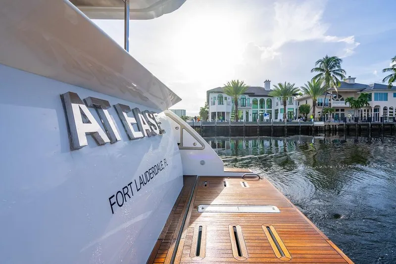 Slide: The Image of Azimut Fly 50 yacht docked in Fort Lauderdale, Florida, with waterfront homes in the background. - 43