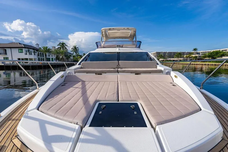 Slide: The Image of Luxurious 2015 Azimut Fly 50 yacht with spacious sun deck, docked by waterfront homes. - 53