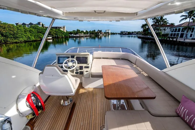Slide: The Image of Flybridge view of 2015 Azimut Fly 50 yacht with scenic waterfront backdrop. - 66