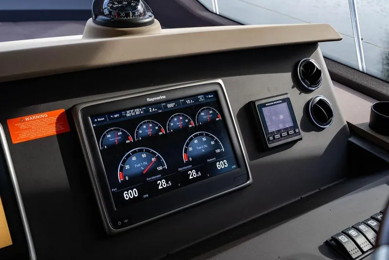 Slide: The Image of Dashboard of 2015 Azimut Fly 50 yacht with Raymarine display and controls. - 89
