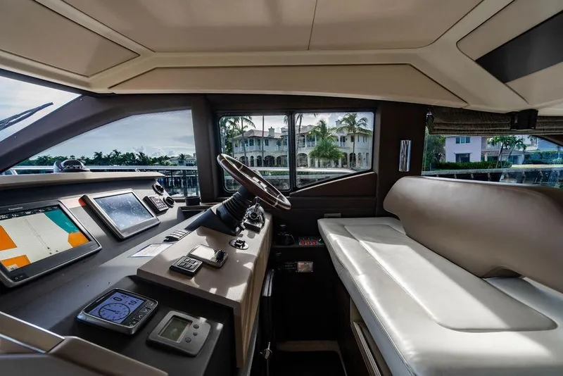 Slide: The Image of Interior of 2015 Azimut Fly 50 yacht cockpit with navigation equipment and seating. - 92