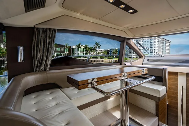 Slide: The Image of Luxurious interior of 2015 Azimut Fly 50 yacht with elegant seating and scenic window view. - 93