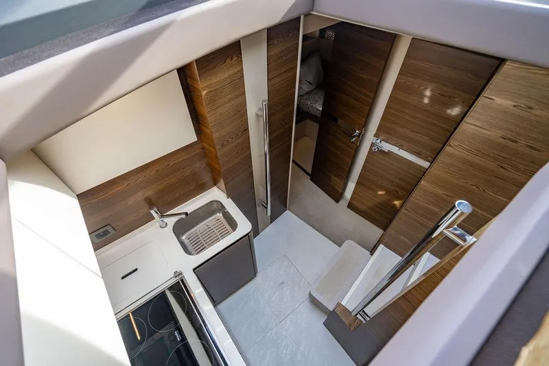 Slide: The Image of Luxurious interior of 2015 Azimut Fly 50 yacht, featuring modern kitchen and wooden finishes. - 96