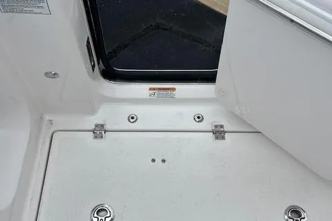 Slide: The Image of 2025 Sea Fox 288 Commander boat deck with storage compartment and stainless steel fittings. - 10