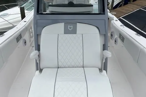 Slide: The Image of 2025 Sea Fox 288 Commander boat with white cushioned seating. - 17