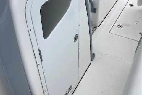 Slide: The Image of 2025 Sea Fox 288 Commander boat interior, featuring a sleek white cabin door. - 18