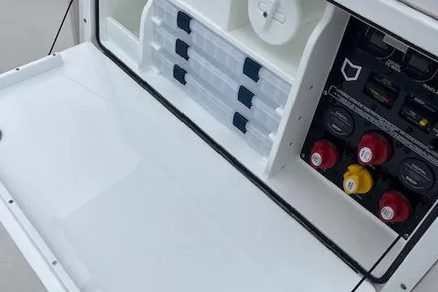 Slide: The Image of 2025 Sea Fox 288 Commander boat storage and control panel with organized compartments. - 8