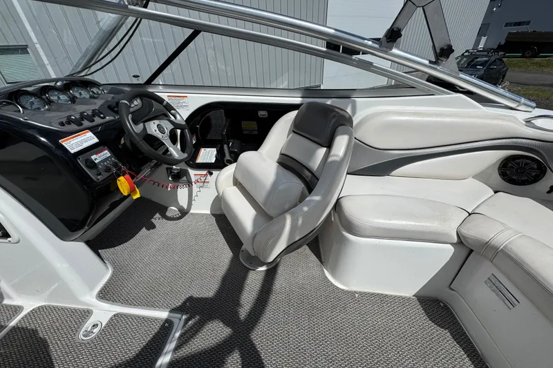 Slide: The Image of 2008 Yamaha Boats 212X interior with steering wheel, seating, and dashboard controls. - 4
