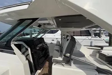 Slide: The Image of 2021 Tiara Yachts 38 LS interior with sleek seating and modern design. - 12