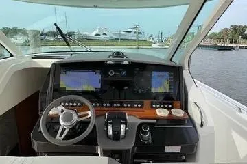 Slide: The Image of Cockpit view of 2021 Tiara Yachts 38 LS with advanced navigation systems. - 14