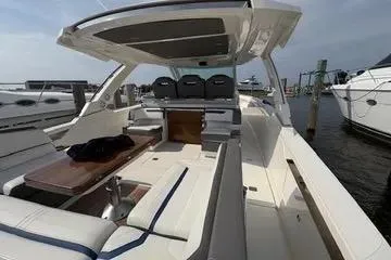 Slide: The Image of 2021 Tiara Yachts 38 LS luxury boat with spacious seating and sleek design. - 19