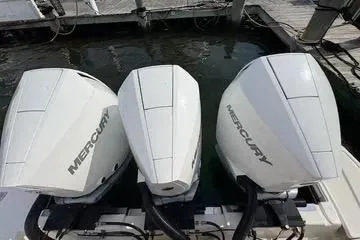 Slide: The Image of 2021 Tiara Yachts 38 LS with triple Mercury outboard engines at dock. - 21