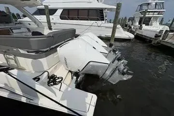 Slide: The Image of 2021 Tiara Yachts 38 LS docked with powerful outboard engines. - 6