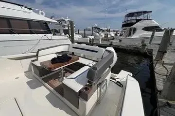 Slide: The Image of 2021 Tiara Yachts 38 LS docked, featuring spacious seating and elegant design. - 8