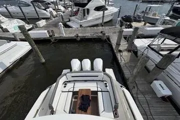 Slide: The Image of 2021 Tiara Yachts 38 LS docked at marina with triple engines. - 9