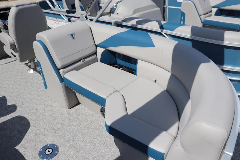 Slide: The Image of Luxurious seating on 2025 Trifecta 22 RF LE 2.75 pontoon boat, featuring blue and gray upholstery. - 10