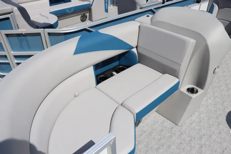Slide: The Image of 2025 Trifecta 22 RF LE 2.75 pontoon boat interior with blue and white seating. - 4