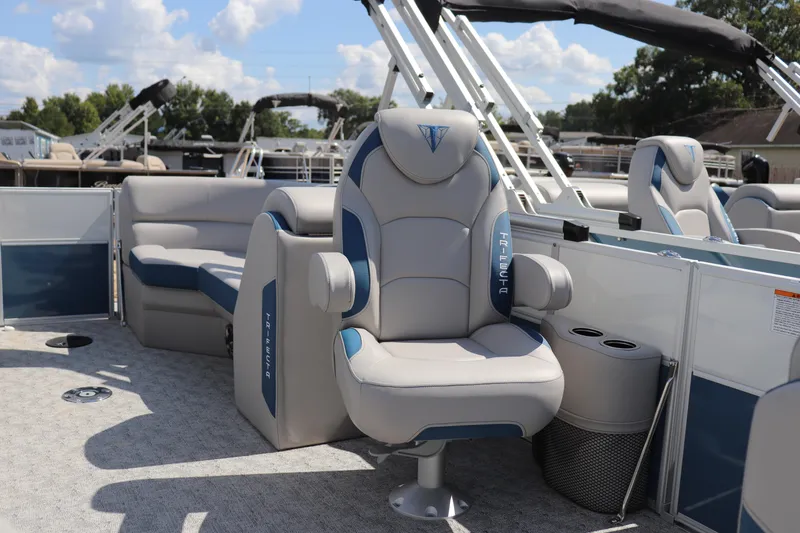 Slide: The Image of 2025 Trifecta 22 RF LE 2.75 pontoon boat with luxurious seating and modern design. - 6