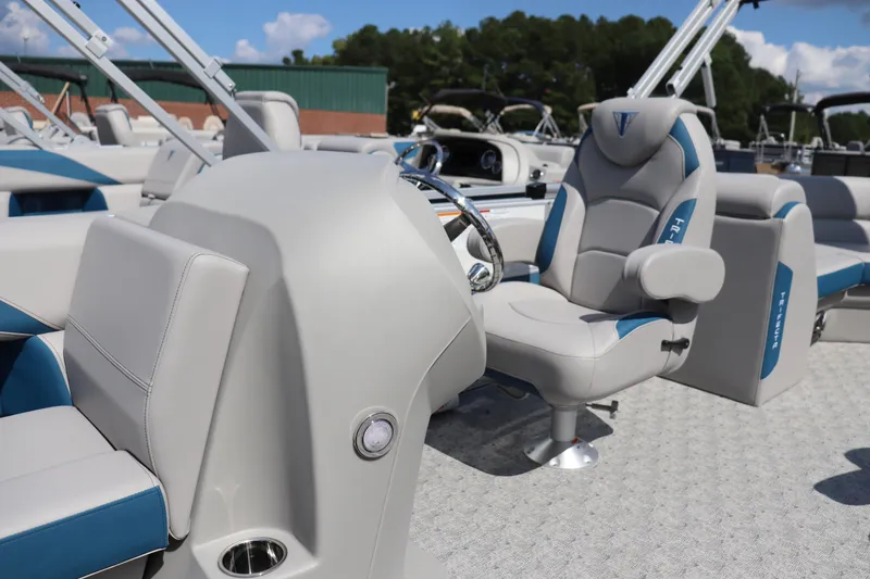 Slide: The Image of 2025 Trifecta 22 RF LE 2.75 boat interior with modern seating and steering wheel. - 7