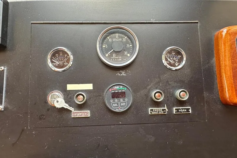 Slide: The Image of Control panel of a 1983 Kadey-Krogen Krogen 42 Trawler with gauges and switches. - 22