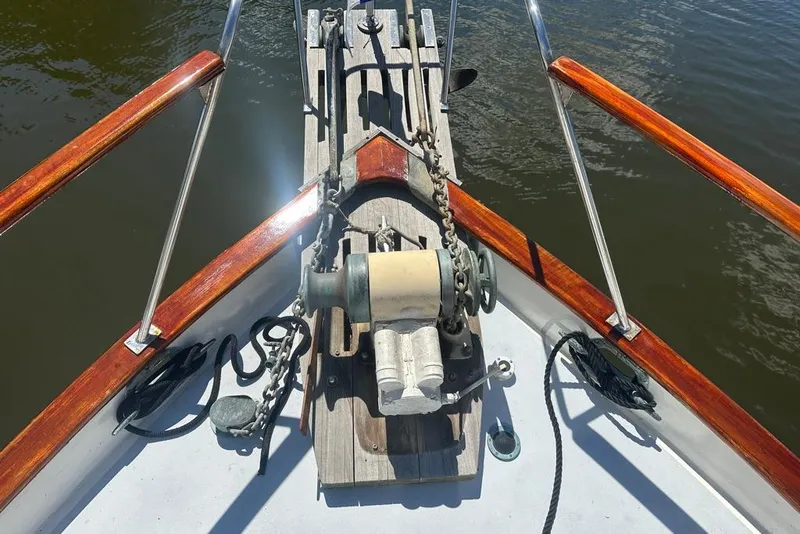 Slide: The Image of Bow of 1983 Kadey-Krogen Krogen 42 Trawler with anchor winch and wooden railings. - 11