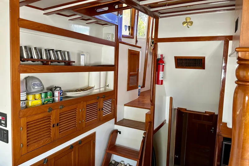 Slide: The Image of 1983 Kadey-Krogen Krogen 42 Trawler interior with wooden shelves and nautical decor. - 25